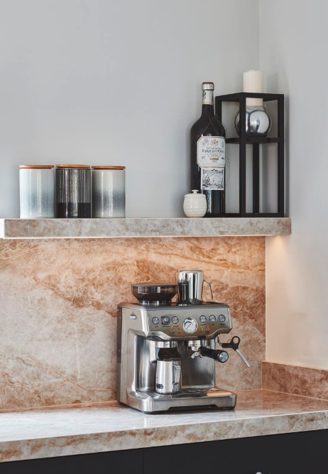 Floating shelves in kitchen above coffee machine